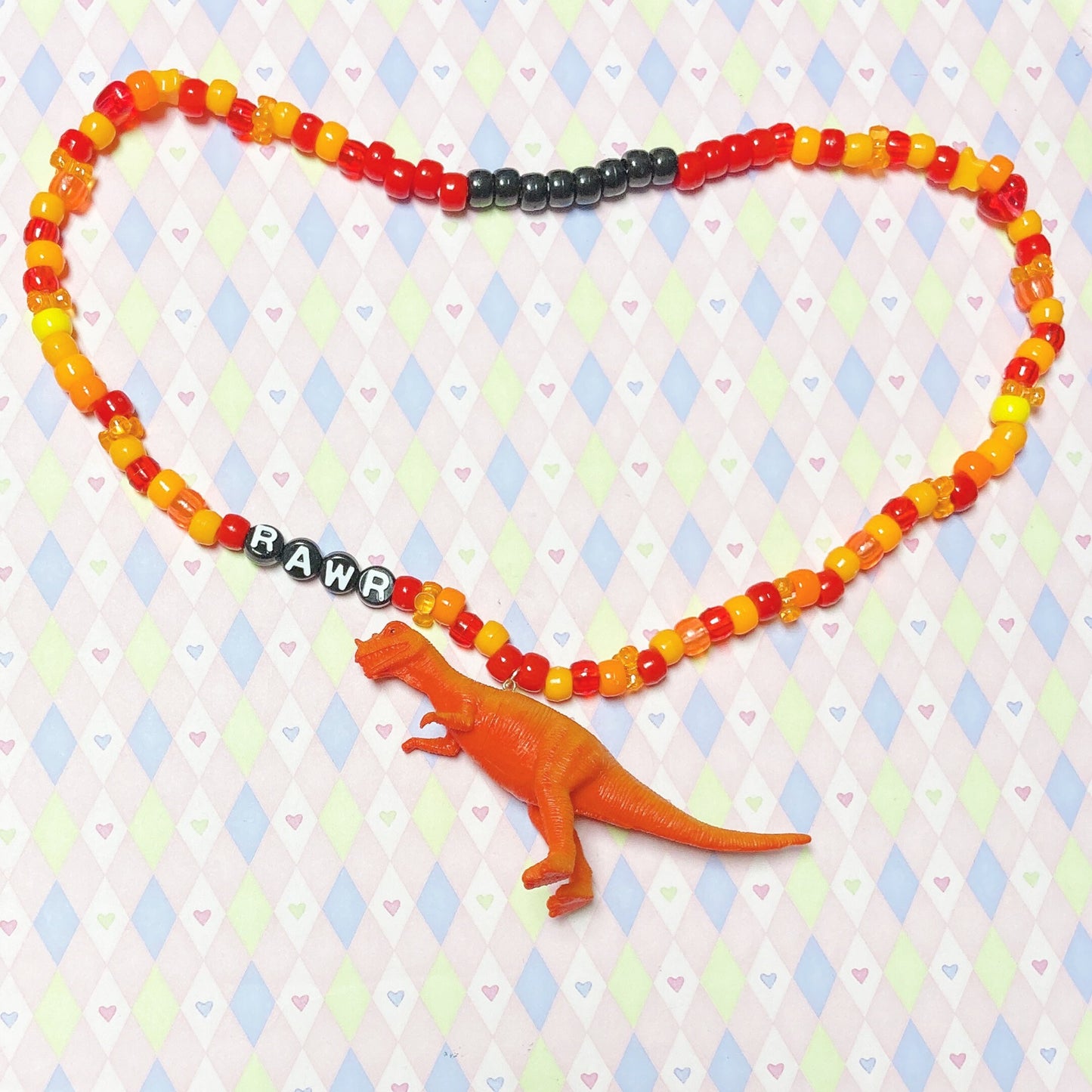 orange 'rawr' dinosaur kandi beaded necklace!