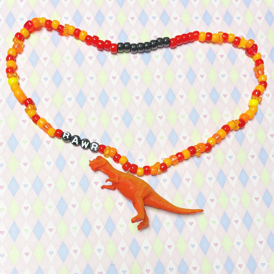 orange 'rawr' dinosaur kandi beaded necklace!